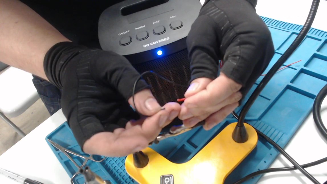 Testing the device's functions by connecting the wires.